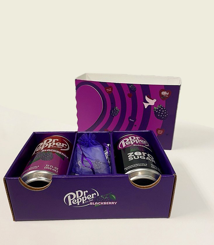Open purple Dr Pepper Blackberry influencer kit with original and zero sugar cans and a gift pouch